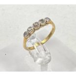 An 18ct gold five stone diamond ring, size L 1/2