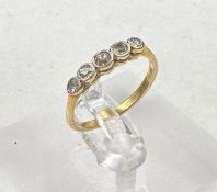 An 18ct gold five stone diamond ring, size L 1/2