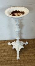 A cast iron bird bath