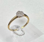 An 18ct gold diamond daisy style ring, size Q