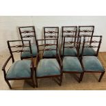 Eight mahogany Regency style dining chairs with carved backs and brass string inlay to include two