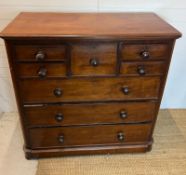 A mahogany chest of drawers with four short and one centre drawer followed by three long (H120cm