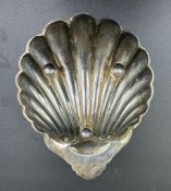 A silver shell, hallmarked for Birmingham 1989 by Roberts & Dore Ltd (Approximate 53g)