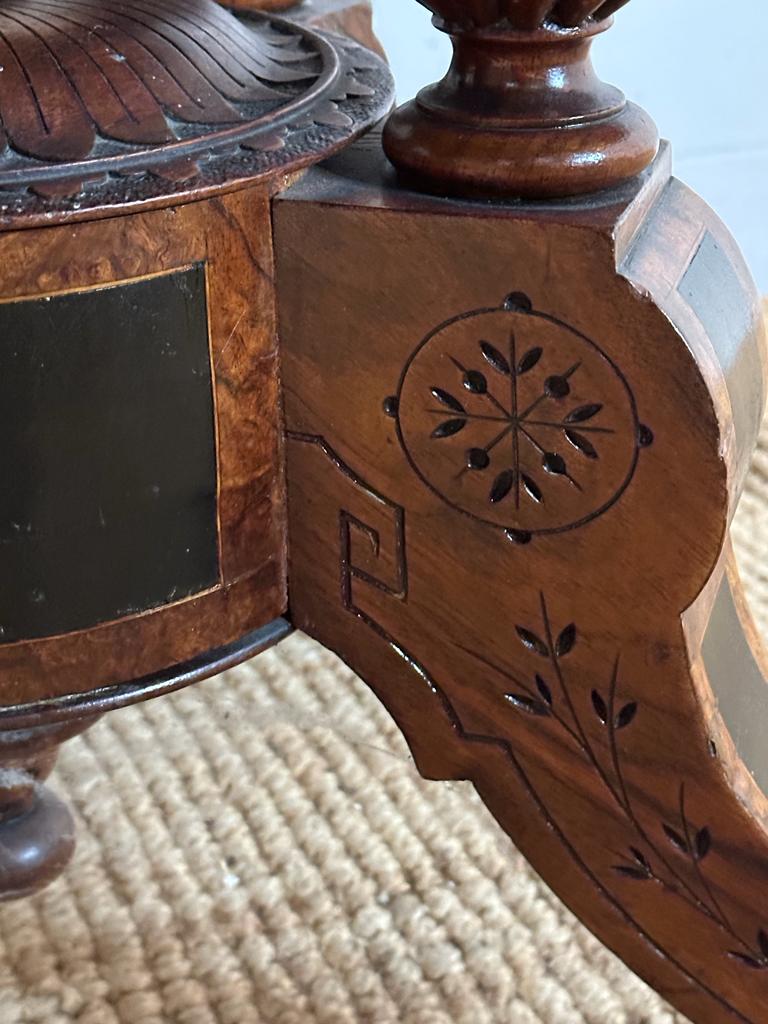 An oval walnut centre table with ebonised inlay and pierced floral detail, on four splayed legs with - Image 3 of 9