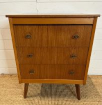 A mid century three drawer chest of drawers on splayed legs. Height 75 44x60