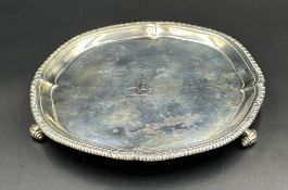A George III silver three footed tray, diameter 20cm, hallmarked for London 1769, makers mark I.C,
