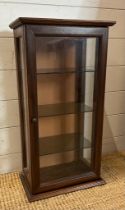 A mahogany wall hanging display cabinet, glazed on three sides with three glass shelves (H63cm W33cm