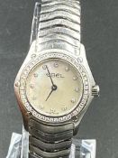 A Ladies Ebel Diamond bezel watched, boxed with papers.