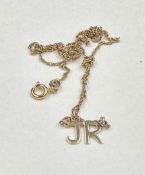 An 18ct gold necklace with JR pendant, approximate weight 2g