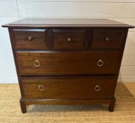 A Mid Century Stag three over two dark wood chest of drawers (H70cm W82cm D46cm)
