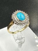 A 9ct gold diamond and turquoise ring. (Approximate Total Weight 3.7g) Size P1/2