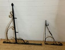A large wrought iron swing sign frame and two wall brackets (H118cm W122cm)