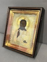 A Russian icon in glazed cased 24cm x 29cm