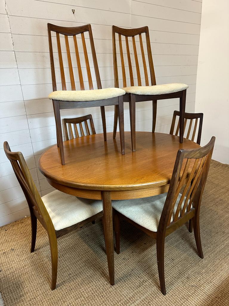A Mid Century G-Plan circular single leaf dining table and six chairs (Dia122cm)