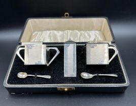 A cased Art Deco silver cruet set, hallmarked for Birmingham 1936 by Sanders & Mackenzie