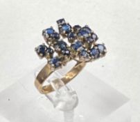 A 14ct gold and blue stone cocktail ring, size P