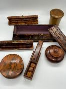 A selection of Treen to include cribbage board, lidded pots etc