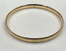 A 9ct gold bangle, approximate total weight 22g