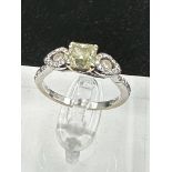 An 18ct white gold decoartive ring set with 1.28ct fancy natural colour radiant cut diamond,