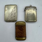 Two white metal vesta cases and one brass