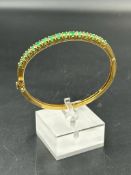 An 18ct gold bracelet with 15 individual emeralds, approximate total weight 17.8g