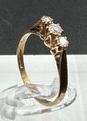 A three stone diamond ring on 9ct gold size L