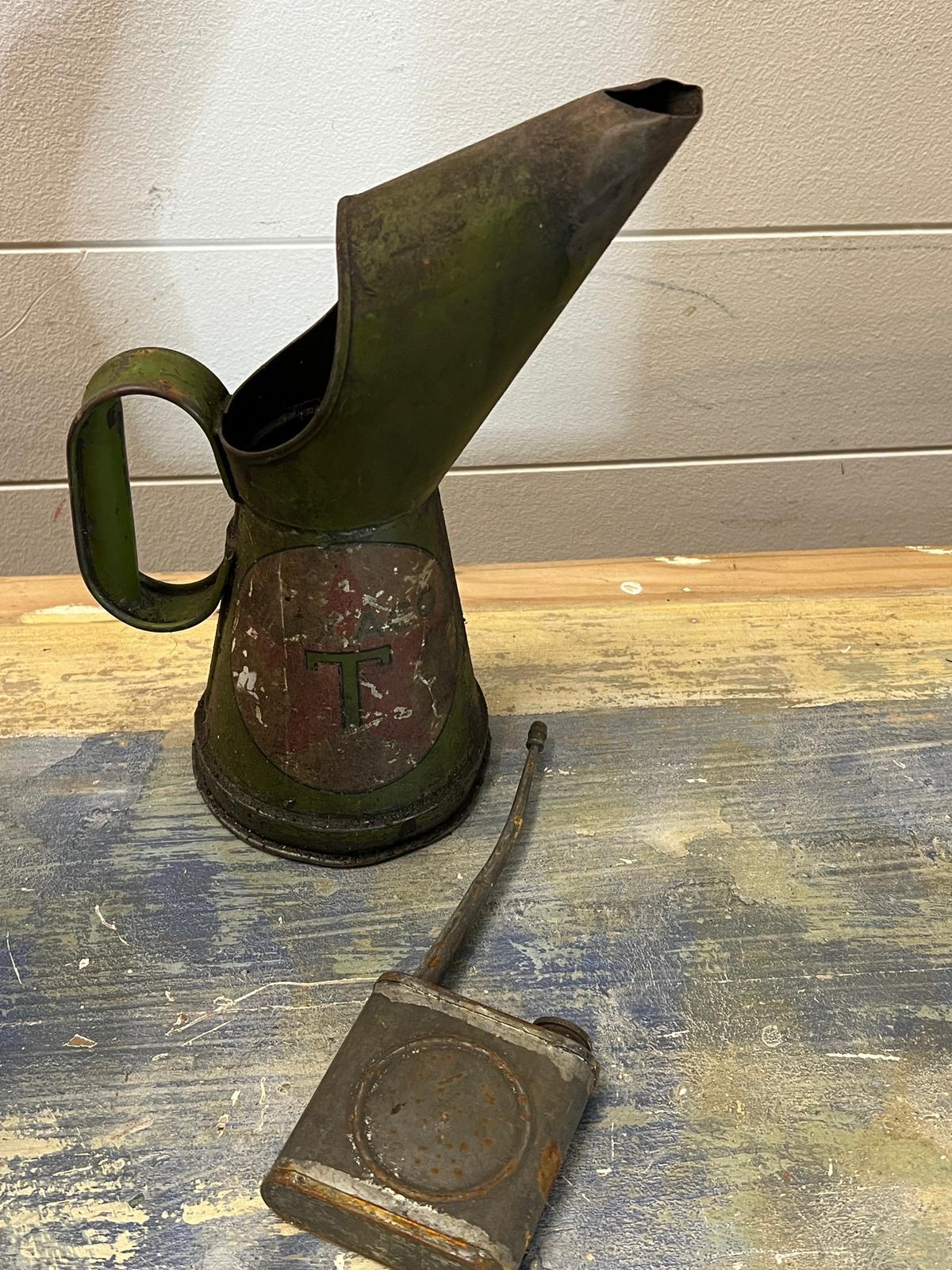 A vintage oil jug and a vintage oil can