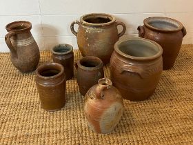 A selection of salt glazed and stone pots various sizes