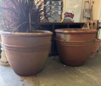 A pair of large terracotta garden planters with ribbed centres (H80cm Dia90cm)