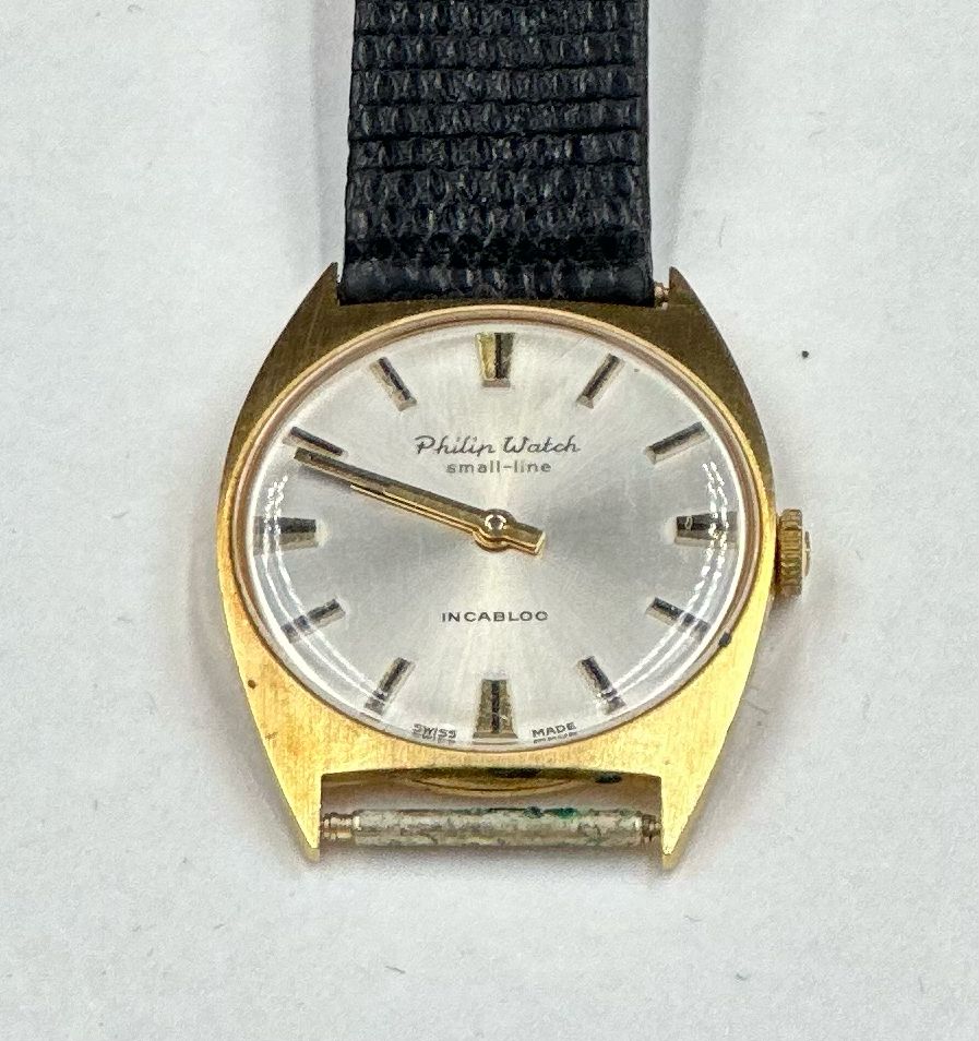 An 18ct gold Philip Watch Chaux De Fonds small-line Incabloc, broken strap.