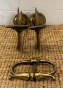 A pair of vintage brass candle sconces and a Regency door pull