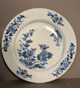 A Chinese Kangxi blue and white bird and peony charger. Diameter 38cm