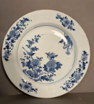 A Chinese Kangxi blue and white bird and peony charger. Diameter 38cm
