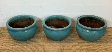 Three glazed teal flower pots