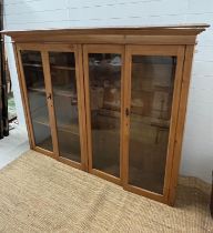 A dresser display top or floor standing display, the glazed doors open to shelves (H150cm W195cm