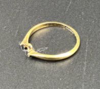 A broken 18ct gold ring, approximate weight 1.3g