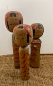 Three large Japanese Kokeshi dolls