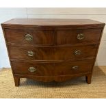A George III style two over two bow fronted chest of drawers (H82cm W105cm D50cm)