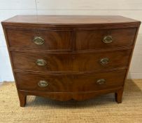 A George III style two over two bow fronted chest of drawers (H82cm W105cm D50cm)