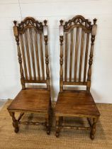 A pair of oak style farmhouse chairs