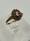 A 9ct gold garnet ring ( Approximate weight 2g) Size N 1/2