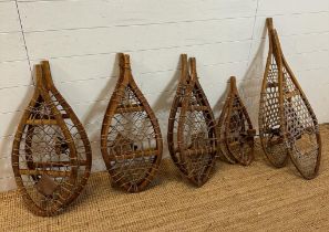 Five pairs of vintage wooden webbed snow shoes