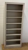 A large painted open bookcase (H220cm W89cm D28cm)