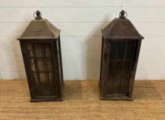 Two large black wooden framed hanging lanterns, lead glazed on all sides with hammered tin roofs (