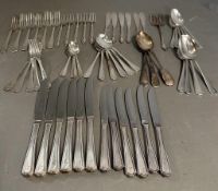 A six place setting cutlery set by Insignia Plate along with some other plated cutlery.