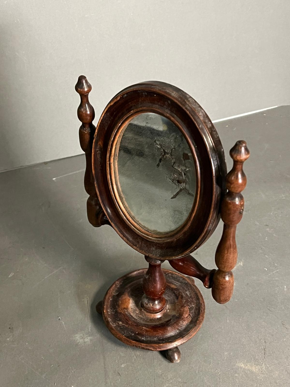 A Victorian mahogany toilet mirror or shaving mirror (H38cm W18cm)