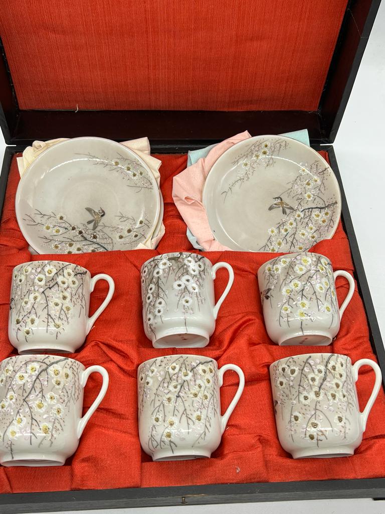 A cased set of porcelain cups and saucers