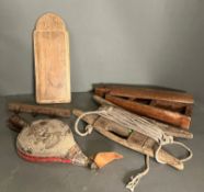 A selection of wooden decorative items including bellows