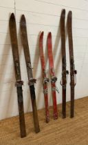 Three pairs of vintage wooden skis