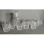 Ten cut glass tumblers and a cut glass decanter